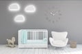 KidÃ¢â¬â¢s room with clocks, gray walls